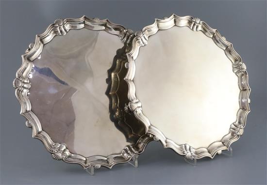 A pair of George II silver shaped circular salvers by John Tuite, 61.5oz.